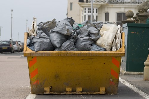 Crew sorting recyclable materials during a flat clearance in Docklands